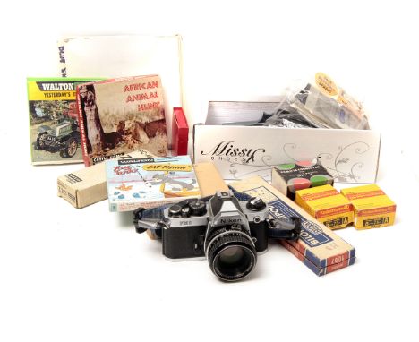 A Nikon FM2n SLR Camera, with AI f/1.8 50mm lens and other accessories (a lot)