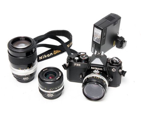 A Nikon FE2 Camera, with Nikkor-H.C. f/2 50mm lens, Nikkor f/2.8 35mm lens and Nikkor-Q f/2.8 135mm lens and other accessorie