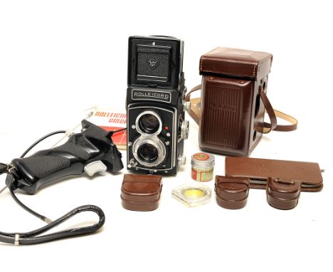 A Rolleicord Vb TLR Camera, with various accessories including pistol grip and more (a lot)good condition, shutter sluggish o