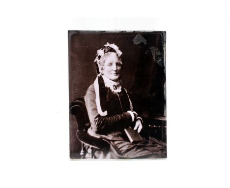 A Photograph on Porcelein Tile, of a seated lady