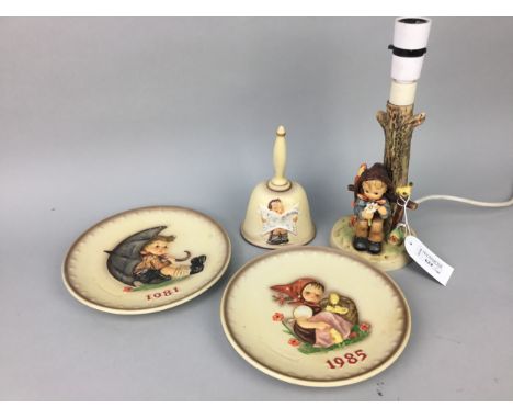 HUMMEL TABLE LAMP, modelled with a seated boy, 27cm high, along with Hummel figures, candlestand and plates (10)