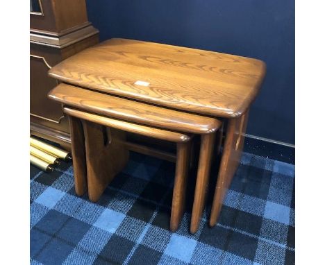 NEST OF THREE ERCOL OAK OCCASIONAL TABLES, 63cm wide