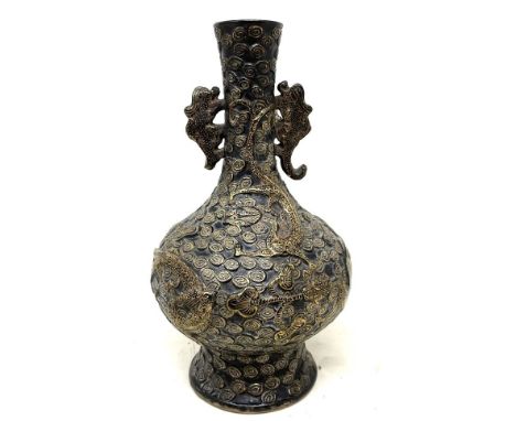 A Chinese pottery vase, decorated a dragon, highlighted in gilt, character mark to base, 23 cm highSome losses to the handles