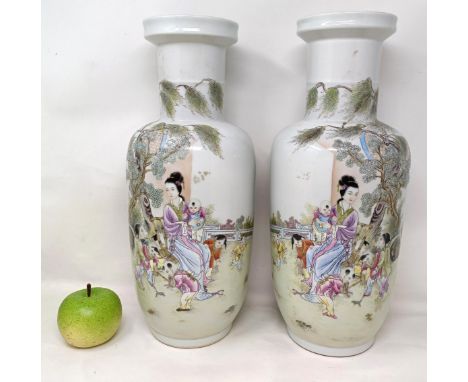 A pair of Chinese famille rose vases, decorated figures, character mark to base, 41 cm high