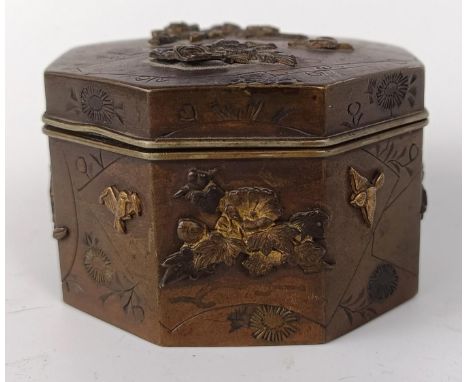 A Japanese bronze octagonal box, decorated butterflies and flowers, lacking base, 6.5 cm wide