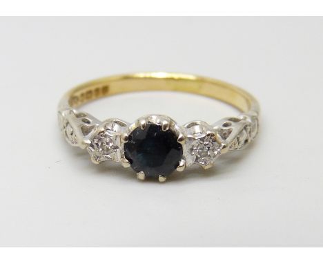 An 18ct gold, sapphire and diamond three stone ring, 2.6g, K/L