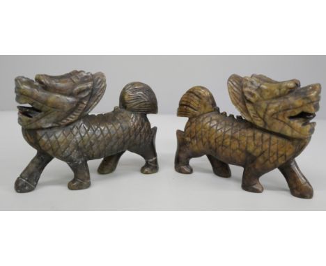 Two carved jade/soapstone figures of foo dogs, each 10.5cm long, one a/f (legs)