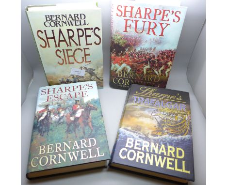 Four hardback first edition books by Bernard Cornwell, Sharpe's Siege, 1987 and the eighth book in the series, Sharpe's Trafa