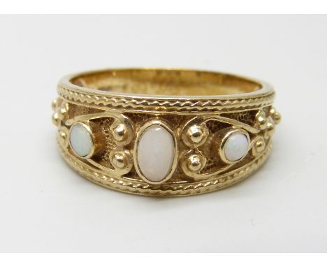 A 9ct gold, three stone opal ring, 4.2g, Q, (one opal replaced)