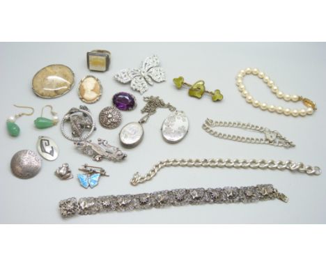 A Victorian silver brooch, a silver bracelet, a silver chain lacking fasteners, a silver locket and chain, a silver ring and 
