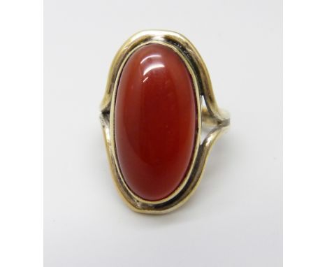 A Carnelian cabochon set ring, I