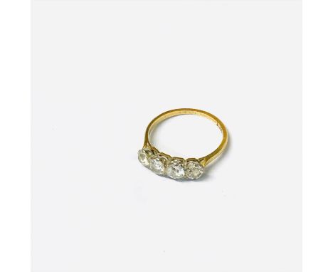 An 18ct gold ring set four diamonds.
