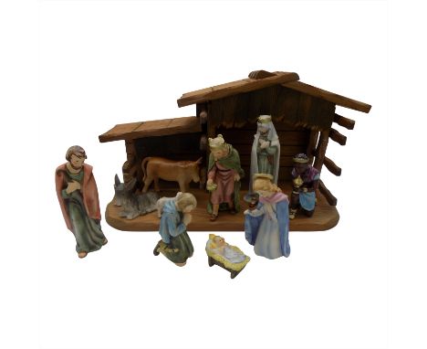 A collection of ten Goebel nativity figures, together with wooden stable (11). (Dimensions: Tallest figure 15.5cm.) (Qty: 1)(