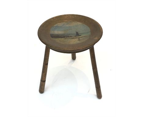 A wood stool on ring turned legs, the dished top painted with a view of St. Michael's Mount. (Dimensions: Height 37cm.)(Heigh