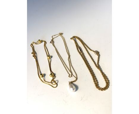 Gold rope chain and pearl on chain and gold ball chain.