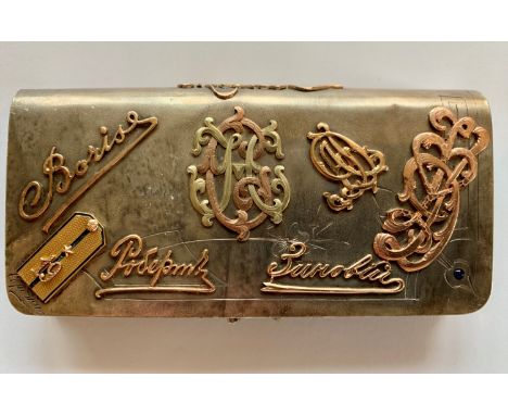 A Russian silver purse with applied gold in two colours incorporating such motifs as fascimile signatures, a uniform lapel an