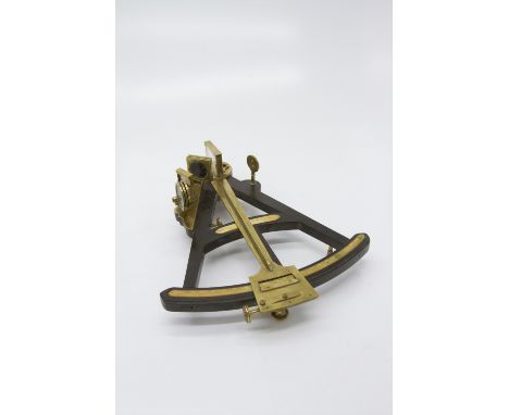 A 19th century brass, ebony and ivory navigational octant, the scale divided to 100 degrees, signed to an ivory plaque. (Dime