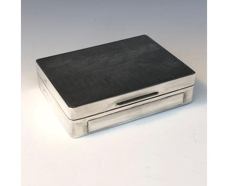 An engine turned silver cigarette box by Garrard &amp; Co Ltd. (Qty: 1)