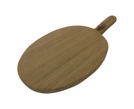 A Thompson of Kilburn 'Mouseman' oak cheeseboard of oval form, with carved mouse signature to raised handle. (Dimensions: Len