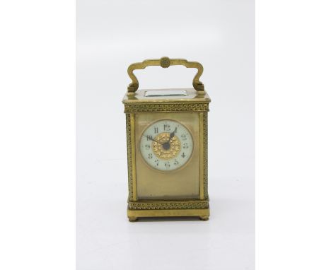 A French carriage timepiece, late 19th century, with matt gilt mask and cream chapter ring, the case with ornate leaf cast de