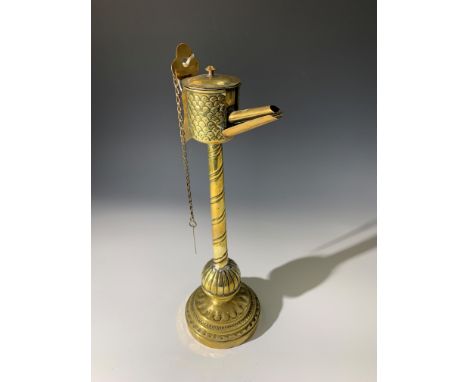 A brass whale oil lamp, possibly Dutch. (Dimensions: Height 43cm.) (Qty: 1)(Height 43cm.)