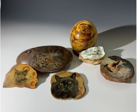 An ostrich egg with hand painted koala decoration, signed Mollie R, with stand, together with a collection of hardstone slice