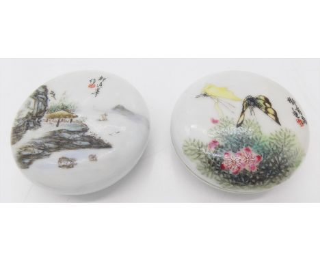 Two Chinese porcelain jars with covers, Republic period, one decorated with a river scene, the others with butterflies, each 