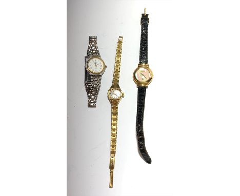 A Ladies Gucci pearl dial wristwatch and two other ladies watches.