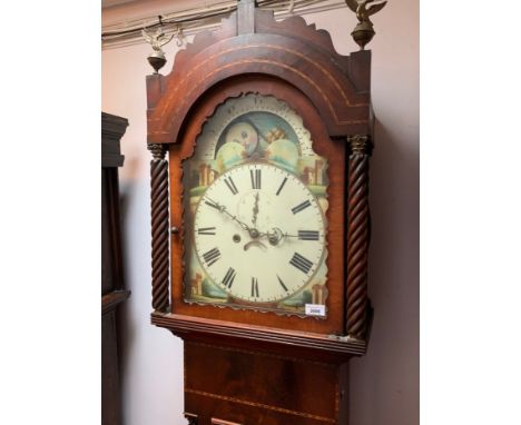 An early 19th century mahogany eight day longcase clock, with a painted rolling moon arched dial flanked by rope twist column