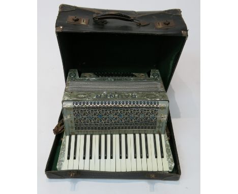 A German Rauner Virtuoso piano accordion, cased.