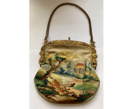 Tapestry evening purse with ornate gilt frame made by Finnegans of New Bond St. Tapestry depicts figures in a pastoral landsc