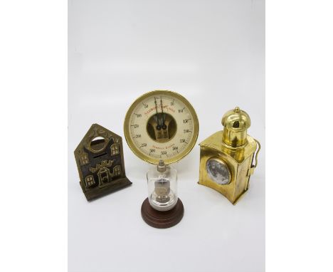 A brass and painted steel money bank, late 19th century, a brass hand lamp, a Mullard valve and a Dewrance brass standard tes
