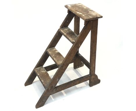 An early 20th century oak step ladder. (Dimensions: Height 71cm, width 32cm.)(Height 71cm, width 32cm.)