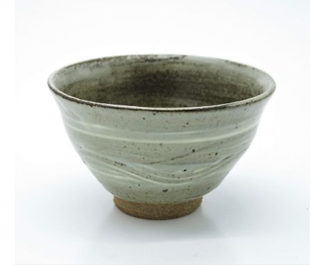 A Leach studio pottery bowl with celadon glaze, impressed mark. (Dimensions: Height 8.5cm.)(Height 8.5cm.)