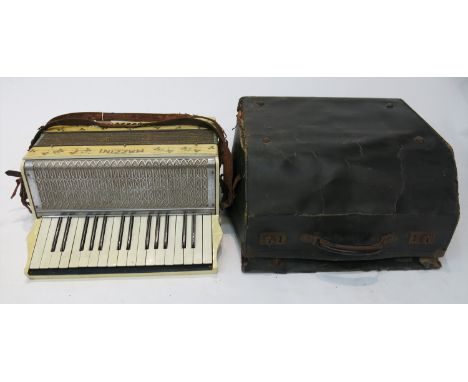 A Mazzini piano accordion with case.
