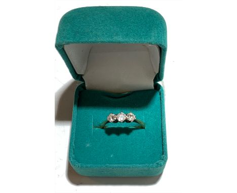 A three stone diamond ring.