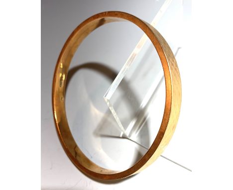 A 9ct gold engine turned bangle, 16gm.Condition report: Small dents. The worst is shown.