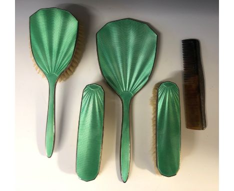 A 1930's silver dressing table set with green guilloché enamel.