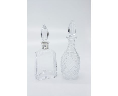 An Orrefors Sweden heavy crystal decanter, the silver collar stamped 925, height 28cm, together with a cut glass decanter.