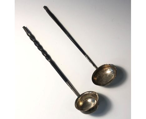 A George III silver toddy ladle with baleen handle together with one other silver toddy ladel.