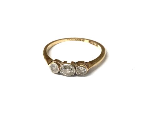 An 18ct gold ring set three diamonds.