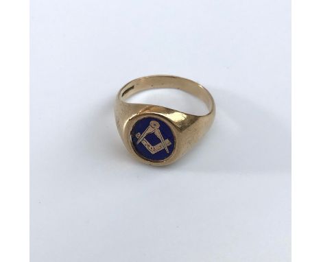 A 9ct gold Masonic ring with rotating blue enamelled Masonic panel.