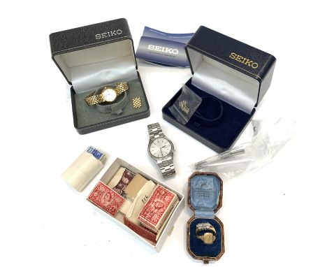 A Seiko 5 stainless steel wrist watch and a ladies gold plated Seiko watch together with a 9ct ring one other ring etc.