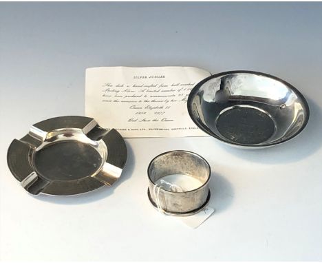 A Cooper Brothers Silver Jubilee commemorative dish together with an engine turned silver ash tray and a silver napkin ring, 