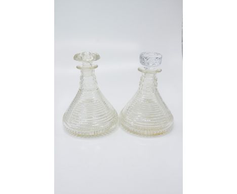 A pair of step cut circular ship's decanters, early 20th century. (Dimensions: Height 23cm.)(Height 23cm.)Condition report: O