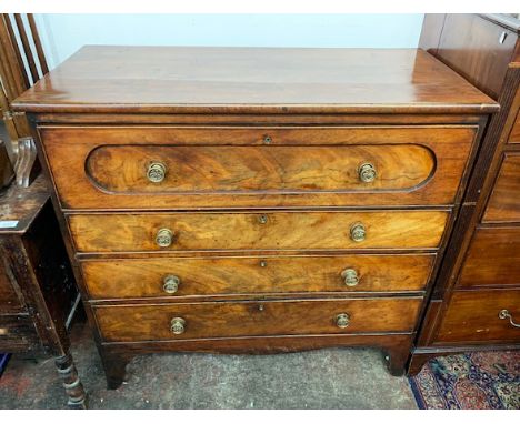 A mahogany secretaire chest, early 19th century, the top drawer opening to reveal a red leather inset writing surface and fit