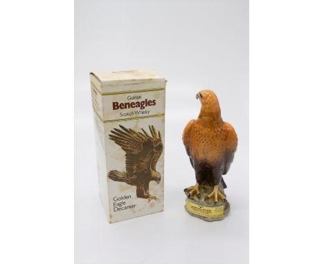 A Beswick Golden Eagle ceramic decanter containing Beneagles Scotch Whisky, sealed and boxed. (Dimensions: Decanter height 26