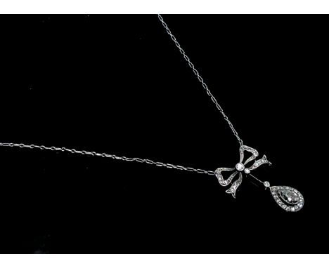 A fine Belle Epoque diamond necklace, from the chain hangs a ribbon and from this swings a pear shape diamond of approximatel