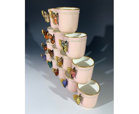 A Royal Worcester coffee service, circa 1875, comprising 15 coffee cans, each with hand painted butterfly handles, 15 saucers