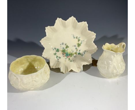 A Belleek milk jug and sugar basin, and a floral decorated dish (3). (Dimensions: Height of jug 8cm.)(Height of jug 8cm.)Cond